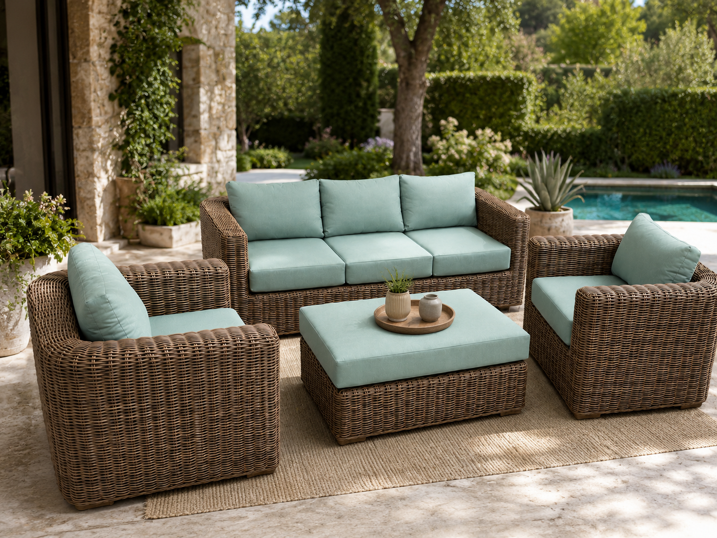 Coastal outdoor rattan conversation set with sage green cushions